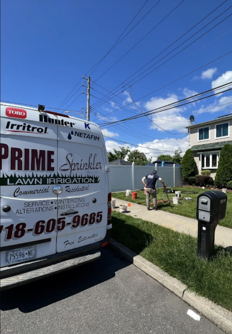 Prime Sprinkler truck and technician at a Staten Island irrigation job
