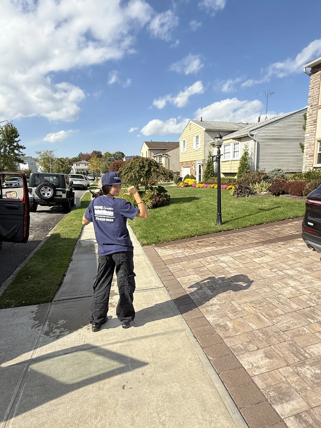 Prime Sprinkler truck and crew working outside a Staten Island property