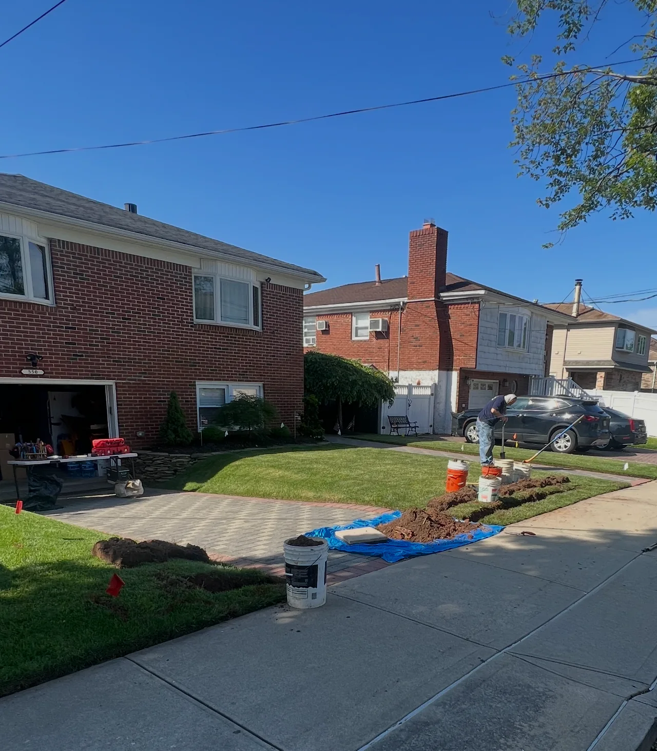 Driveway boring setup for sprinkler lines under concrete