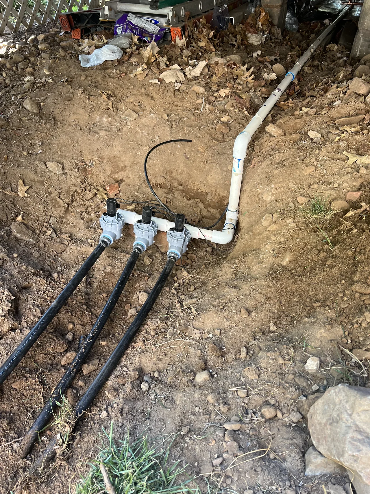 Sprinkler valve manifold and irrigation piping during service