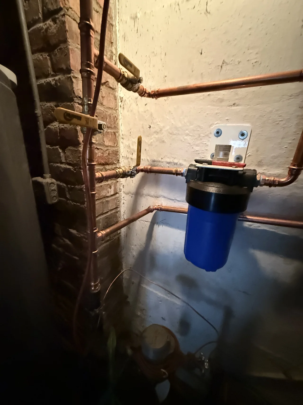 Irrigation pipe run along an exterior wall