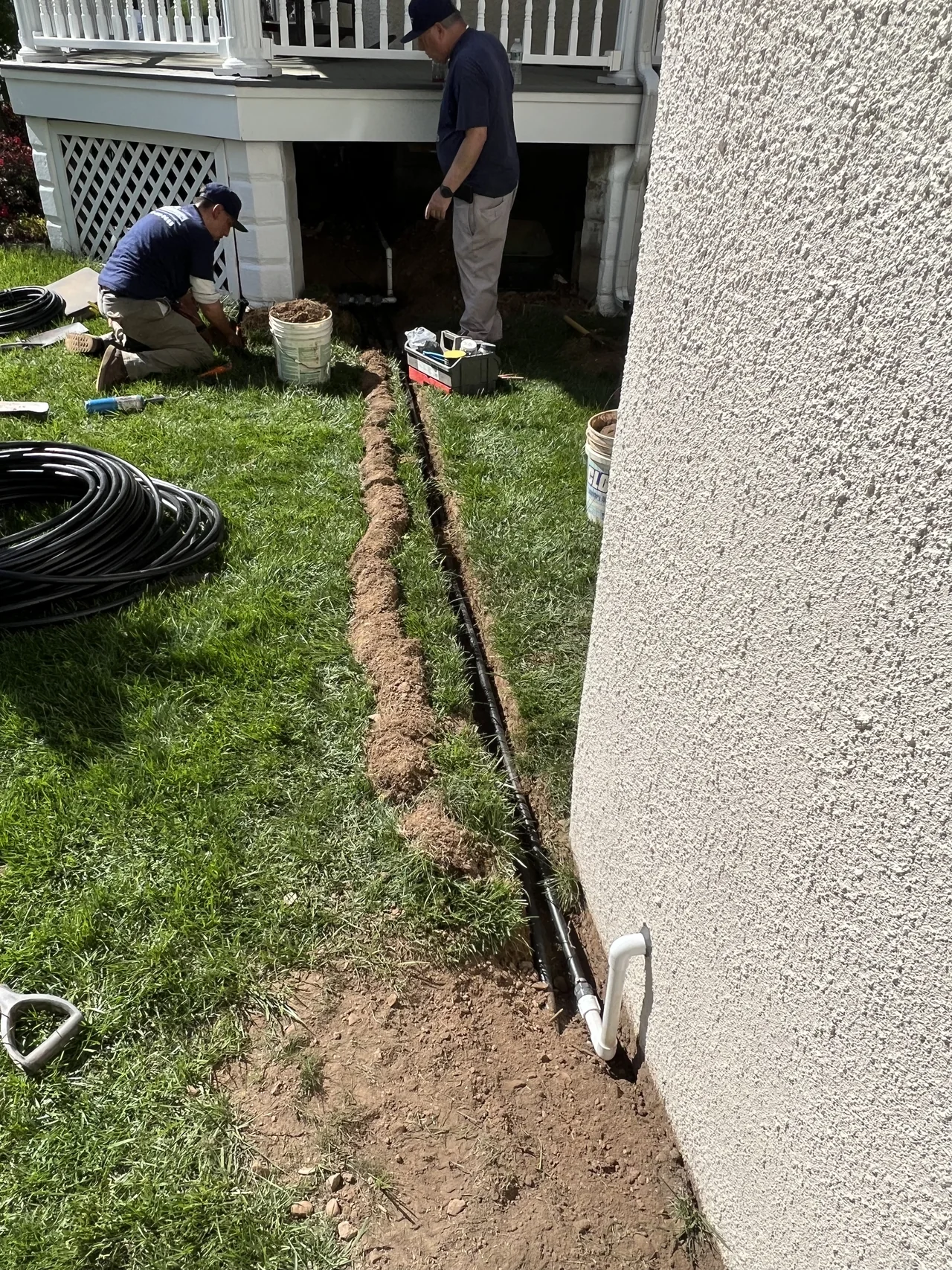 Side yard trench opened for sprinkler pipe installation