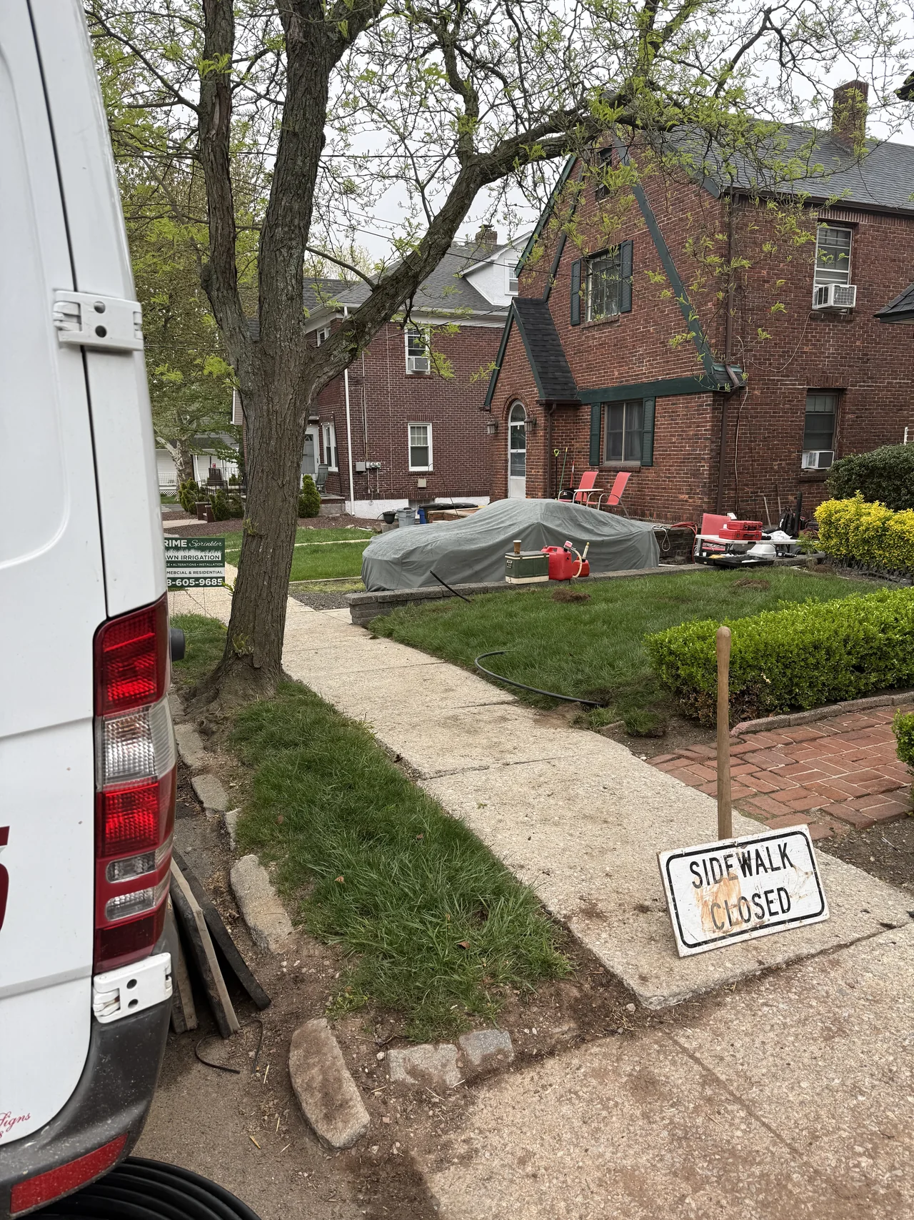 Prime Sprinkler truck parked at a Staten Island curbside job