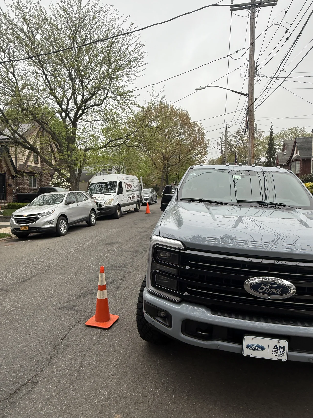 Prime Sprinkler service truck parked on a Staten Island street