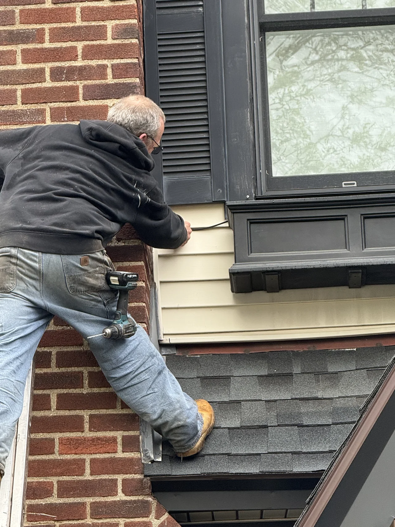 Irrigation service work near basement windows and exterior piping